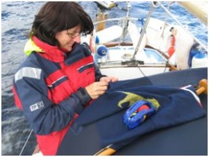 Pippa, mending the ensign.